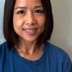 Nan Gramaglia, smiling, with shoulder-length dark hair and a blue Star Lab T-shirt.